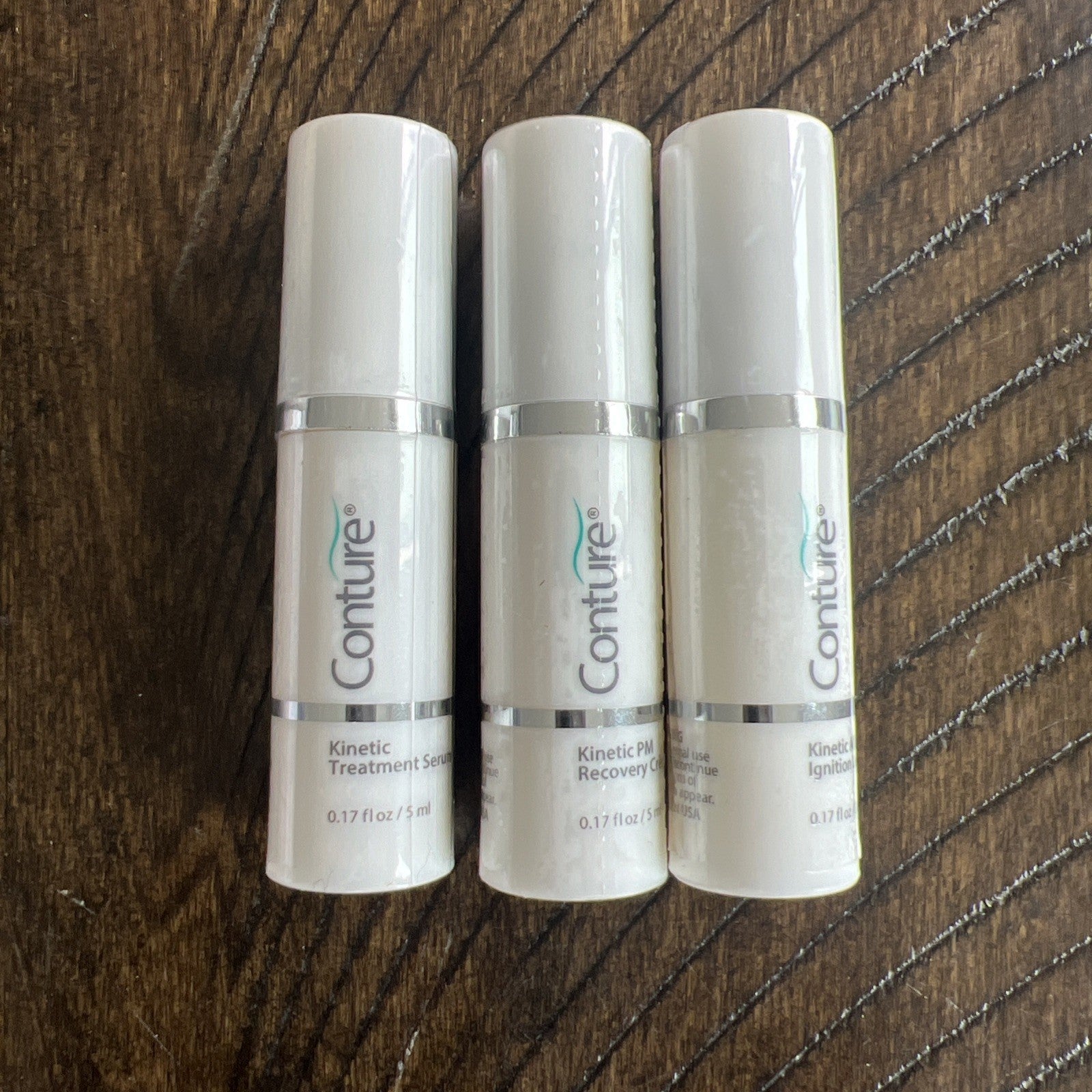Conture Face+Neck Kinetic Skin Toning System. NEW SEALED. W/case & Serums (3).